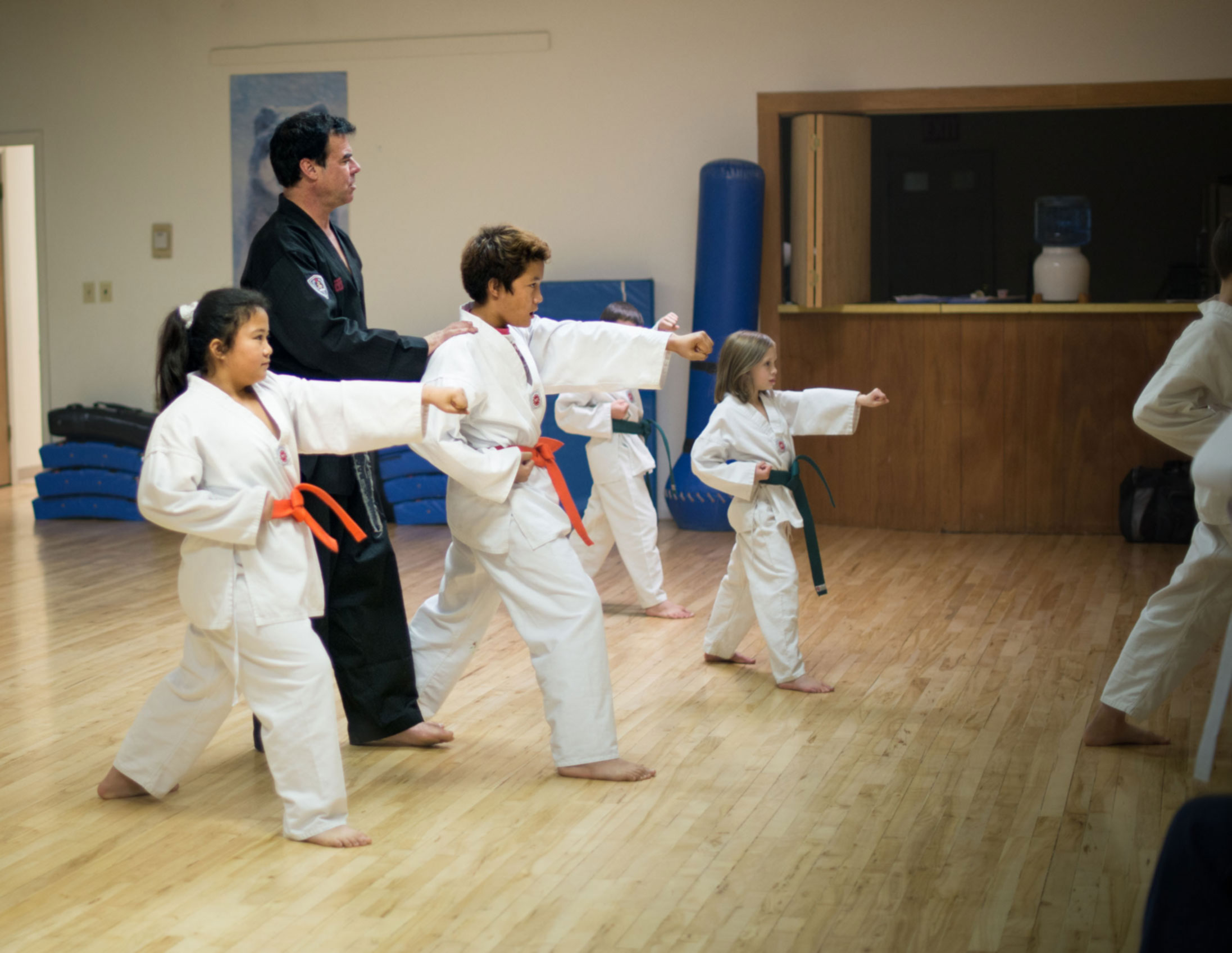 Kids Taekwondo class performing Taeguk forms